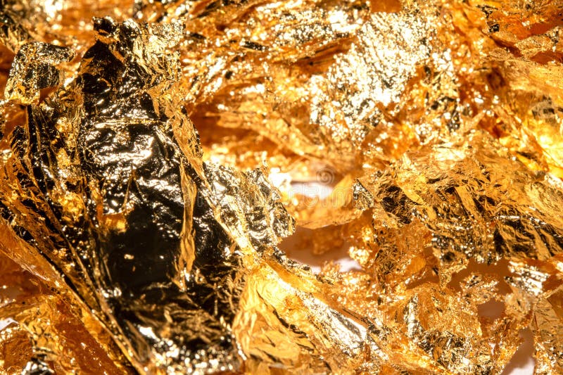 Gold Leaf Pieces Close Up on a White Background As Decorative Pieces