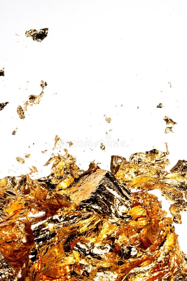 Gold Leaf Pieces Close Up on a White Background As Decorative Pieces