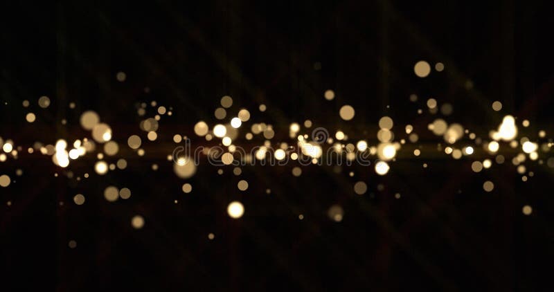 Gold light bokeh sparks, golden glitter shine. Shiny bright snow bokeh blur effect, shimmering dust light and magic glow sparkles