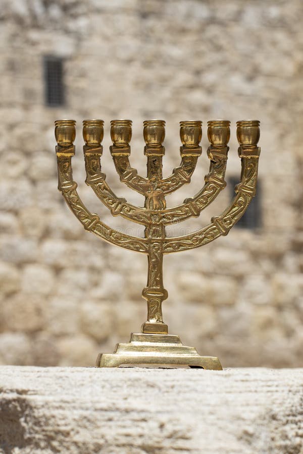 A Gold Menorah with a Background of the Walls of Jerusalem Stock Photo