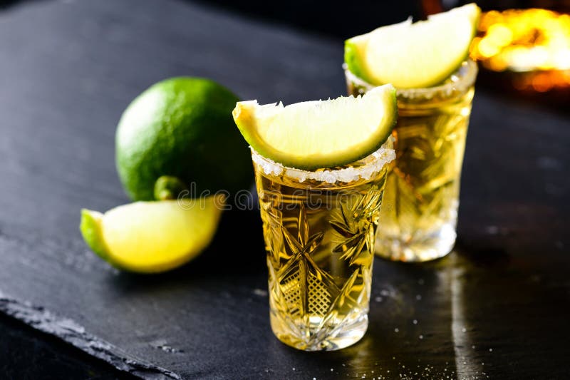 Mexican Gold Tequila with Lime and Salt on Stone Bar Counter Stock ...