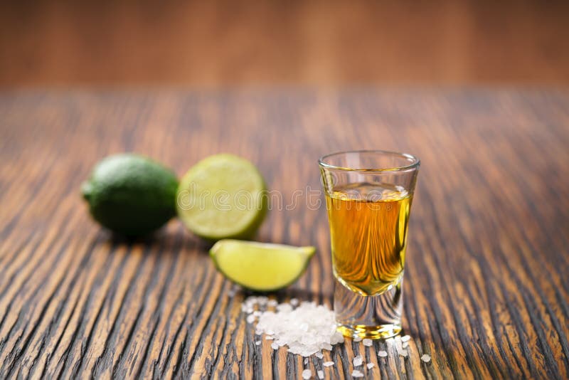 Gold mexican tequila shot ,selective focus royalty free stock photography Gold mexican tequila shot ,selective focus royalty free stock photography