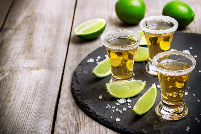 Gold mexican tequila shot stock photo. Image of closeup - 67232658