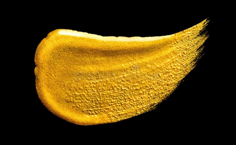 Gold paint Brush stroke isolated on black background Flowing abstract Gold metallic paint smudge close-up 免版税库存图片 Gold paint Brush stroke isolated on black background Flowing abstract Gold metallic paint smudge close-up 免版税库存图片
