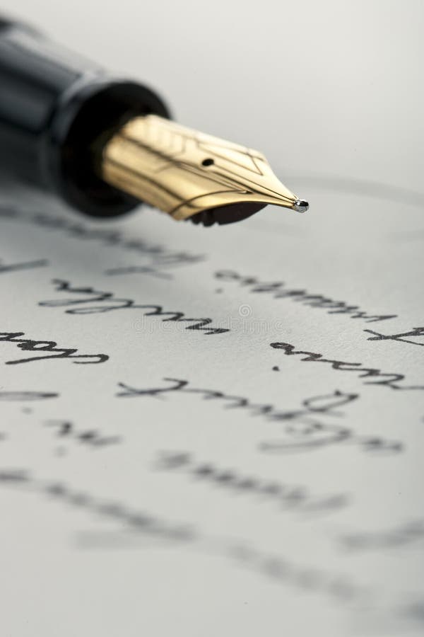 Gold pen on hand written letter