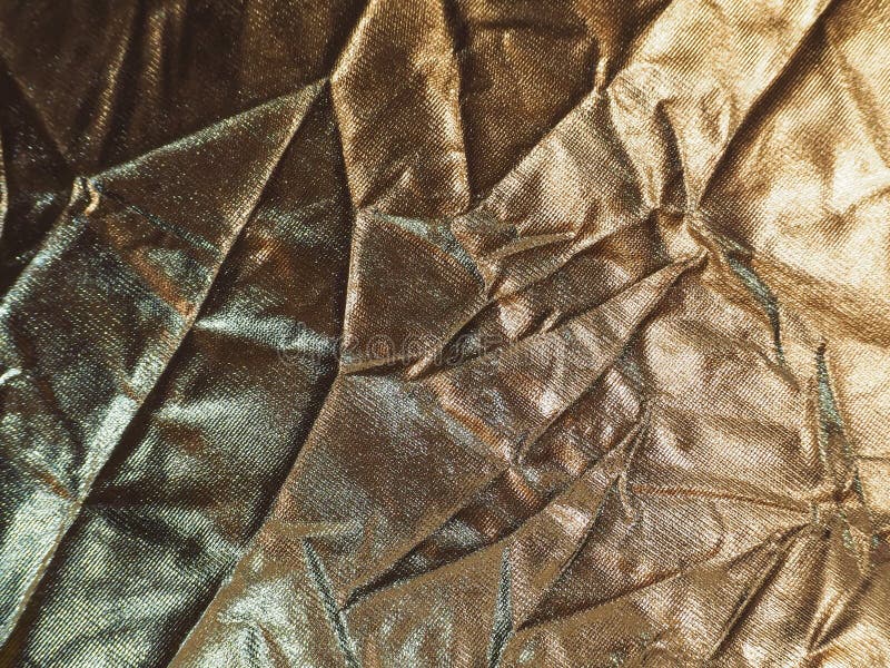 Gold Reflective Plastic with Crumpled Surface for Use As a Background. Stock Image Image of