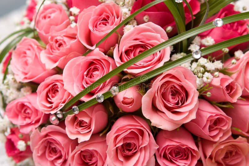 Gold rings and rose bouquet