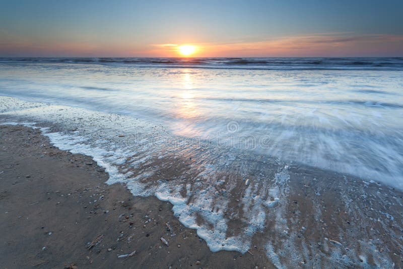 Gold sunset over North sea beach