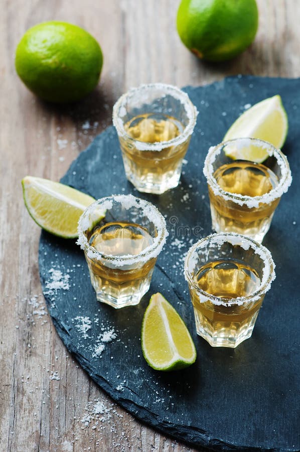 Gold Tequila with Lime and Salt Stock Photo Image of tequila, yellow 61389356