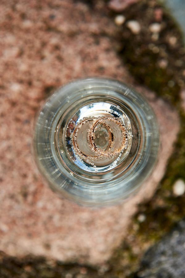 Gold Wedding Rings in a a Glass of Champagne Stock Image Image of