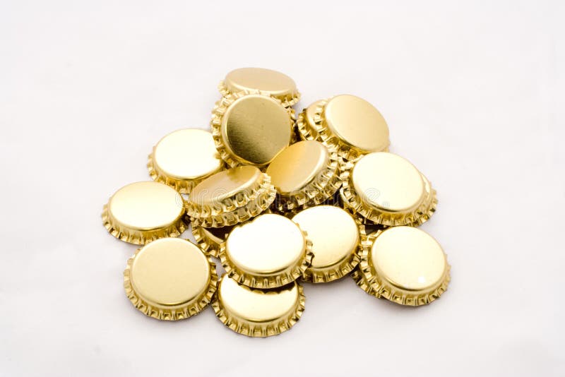 Golden beer bottle caps stock image. Image of closeup 6406613