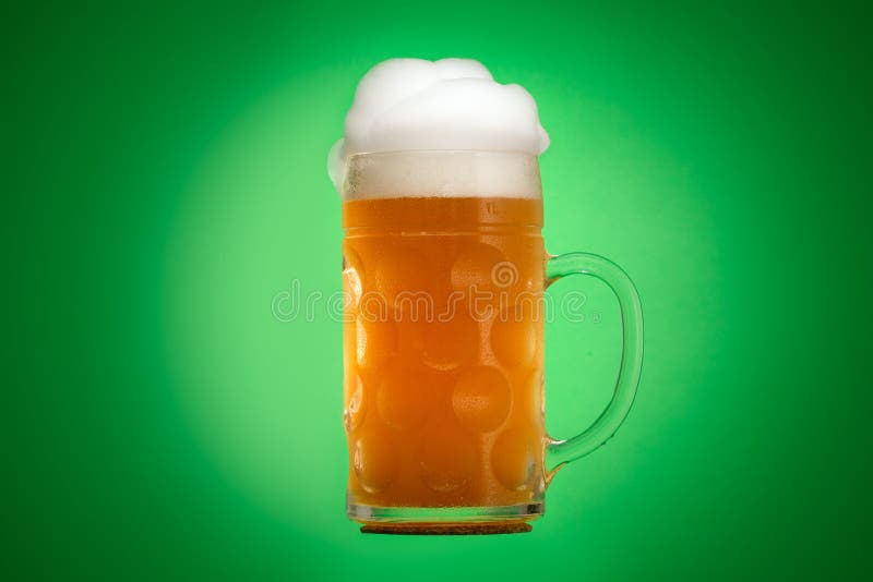 Golden beer in glass with foam, alcohol beverage drink,  gold