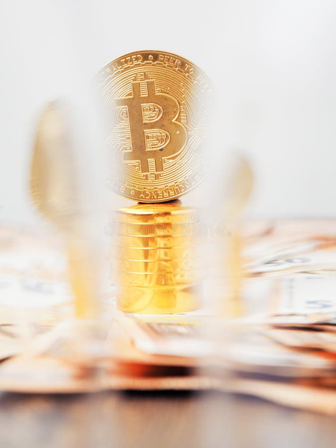 Golden bitcoin on golden basement over euro banknotes. Time to invest into crypto currency concept. Economy and financial stock photography