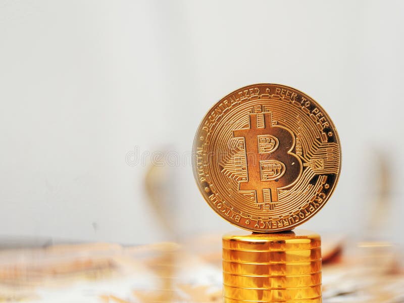 Golden bitcoin on golden basement over euro banknotes. Time to invest into crypto currency concept. Economy and financial stock photo