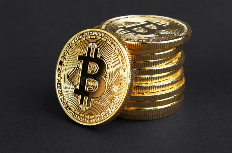 Golden Bitcoin on black stock photography