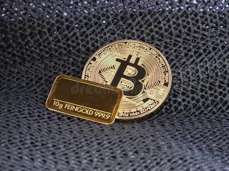 Golden Bitcoin and gold bar. stock photo