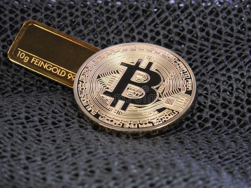 Golden Bitcoin and gold bar. royalty free stock photography