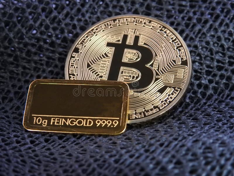 Golden Bitcoin and gold bar. stock image
