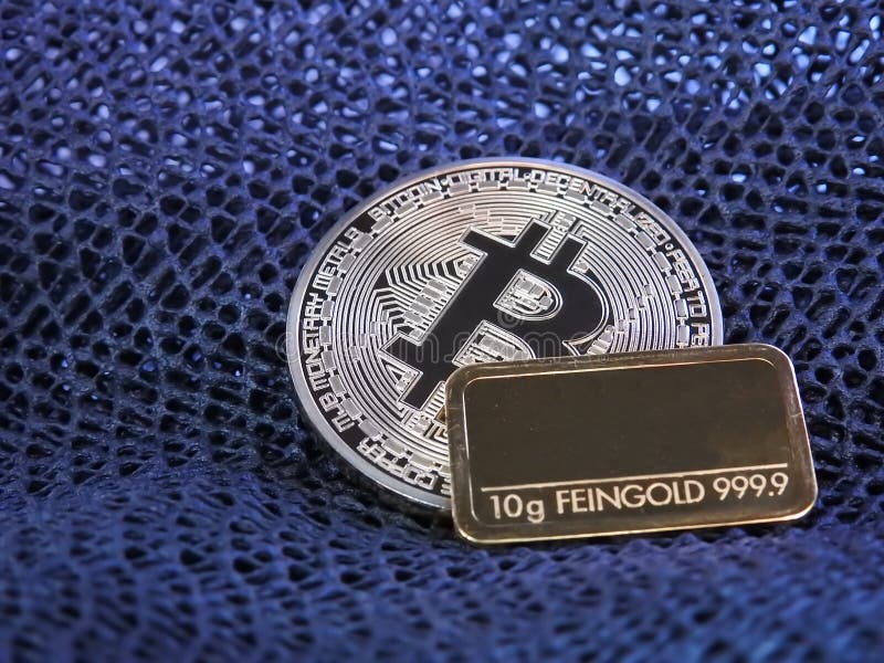 Golden Bitcoin and gold bar. royalty free stock image