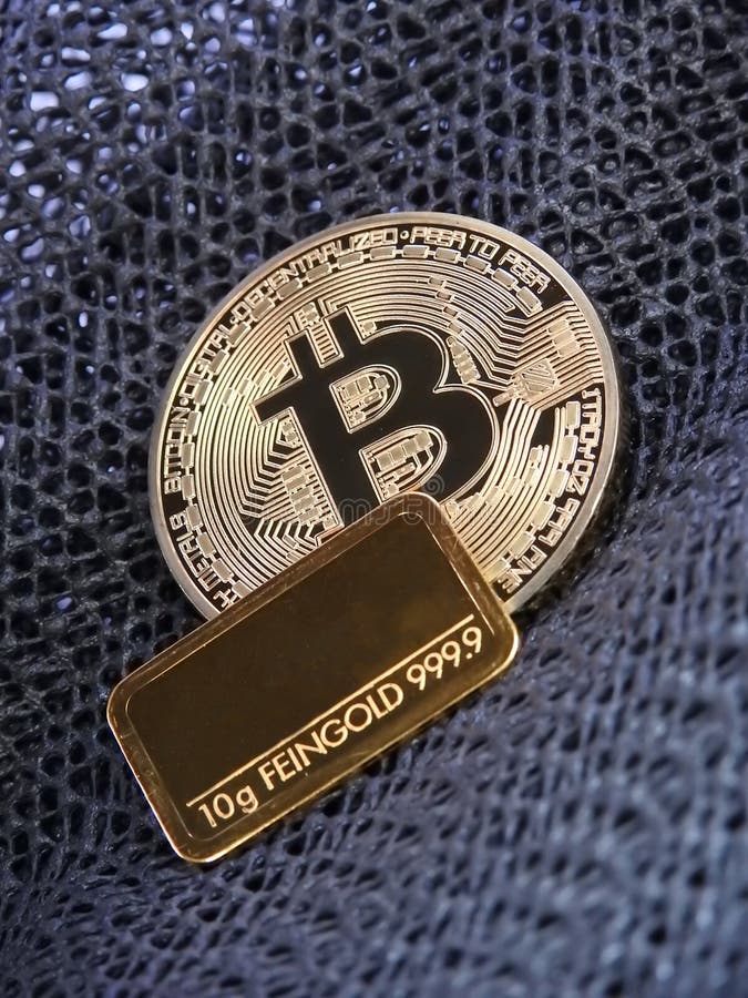 Golden Bitcoin and gold bar. stock photos