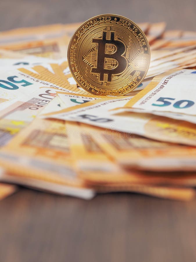 Golden bitcoin standing on euro bank notes. Time to invest into crypto currency concept. Economy and financial background. Get stock photo