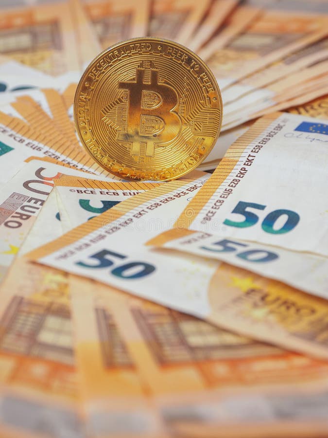 Golden bitcoin standing on euro bank notes. Time to invest into crypto currency concept. Economy and financial background. Get stock photo