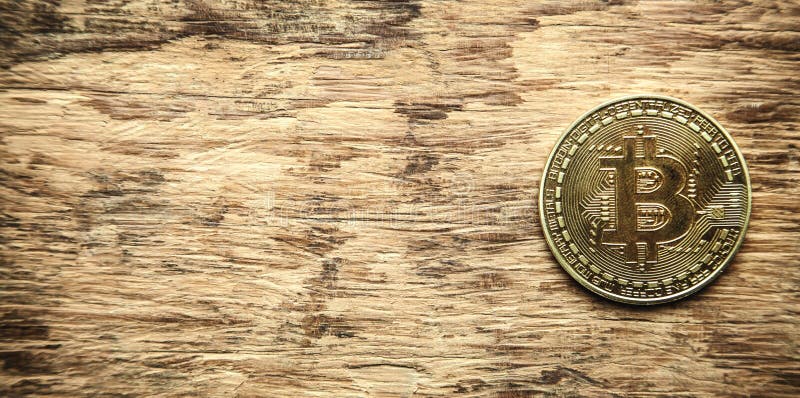 Golden bitcoin on wooden desk. royalty free stock photos Golden bitcoin on wooden desk. royalty free stock photos