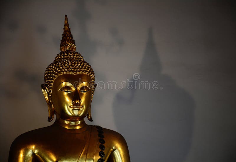 Golden buddha with shadow royalty free stock image Golden buddha with shadow royalty free stock image
