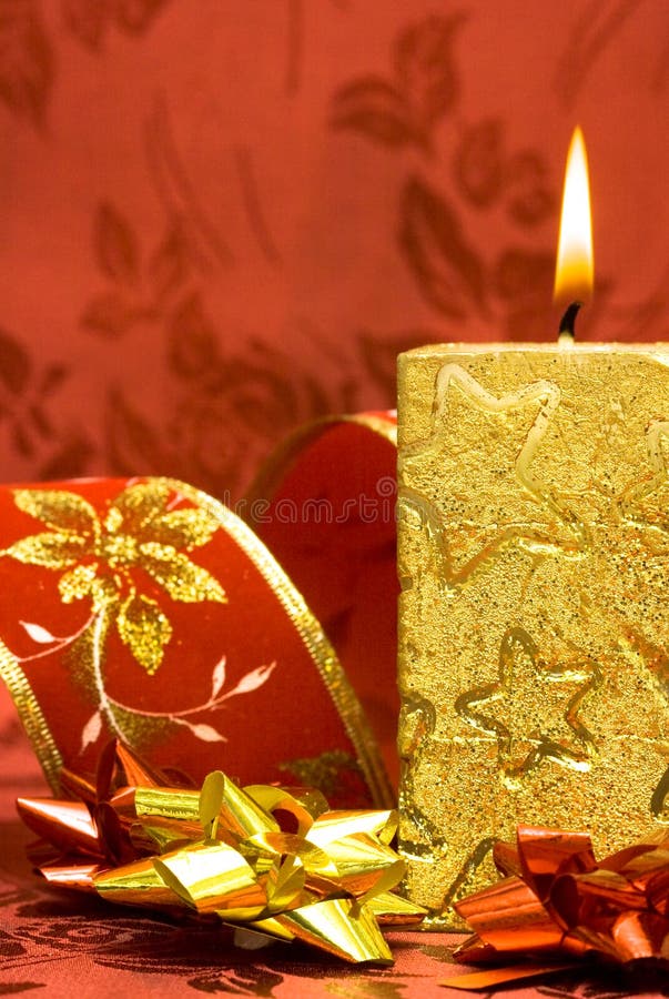 Golden candle with flowers stock image. Image of bodycare 3689317