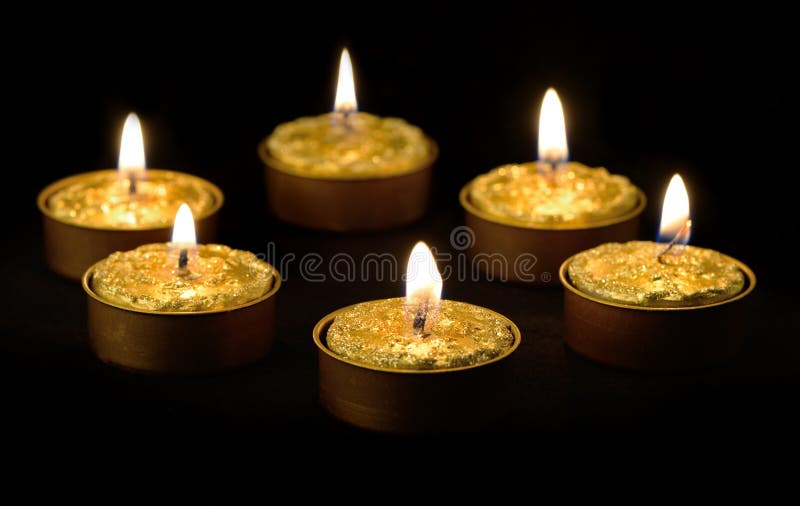 Golden Candles On A Black Background. Stock Photo Image of energy