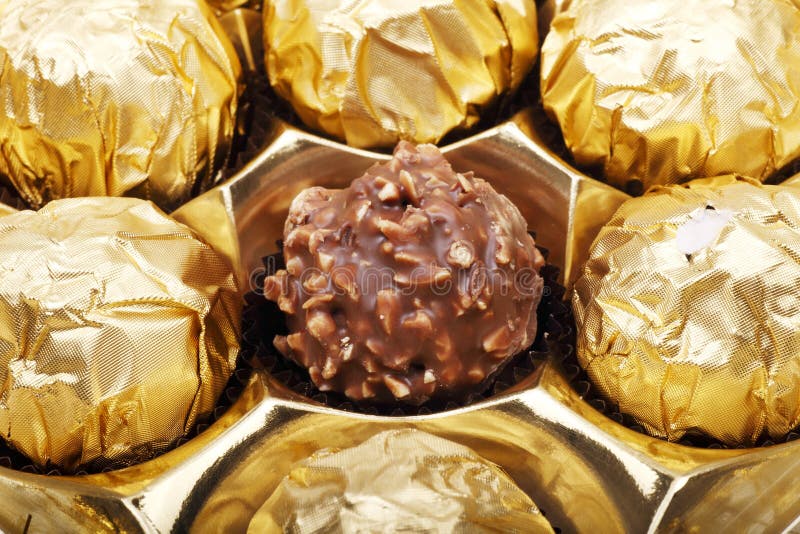 Golden chocolate closeup stock image. Image of candy 12218903
