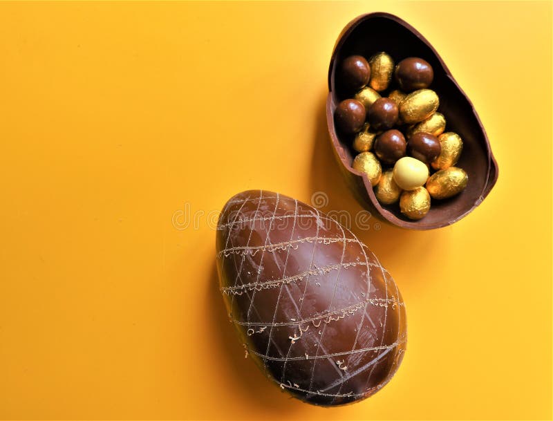 Golden Chocolate Easter Eggs and Chocolate Bunny with Copy Space Stock