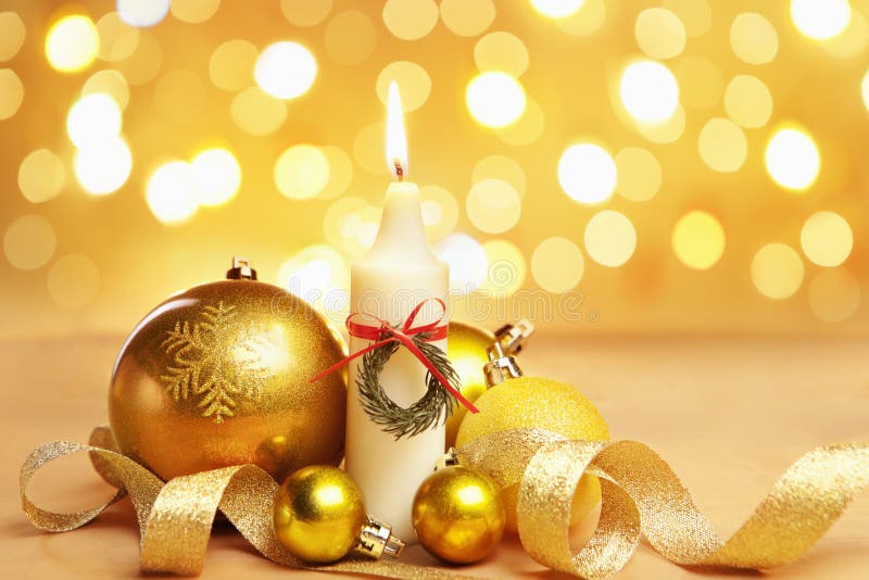 Golden Christmas ornament and candle