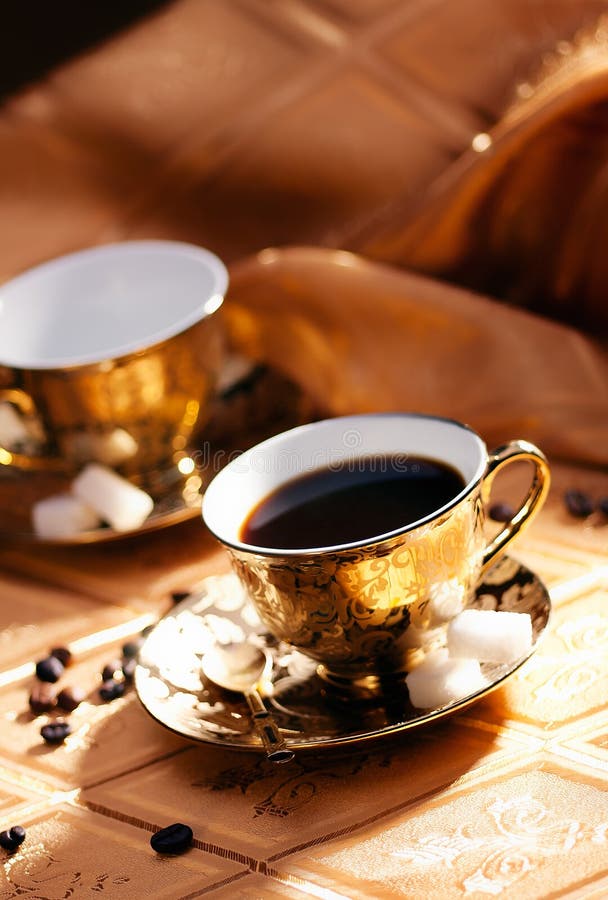 Golden coffee stock image. Image of simple, ceramics 18422155