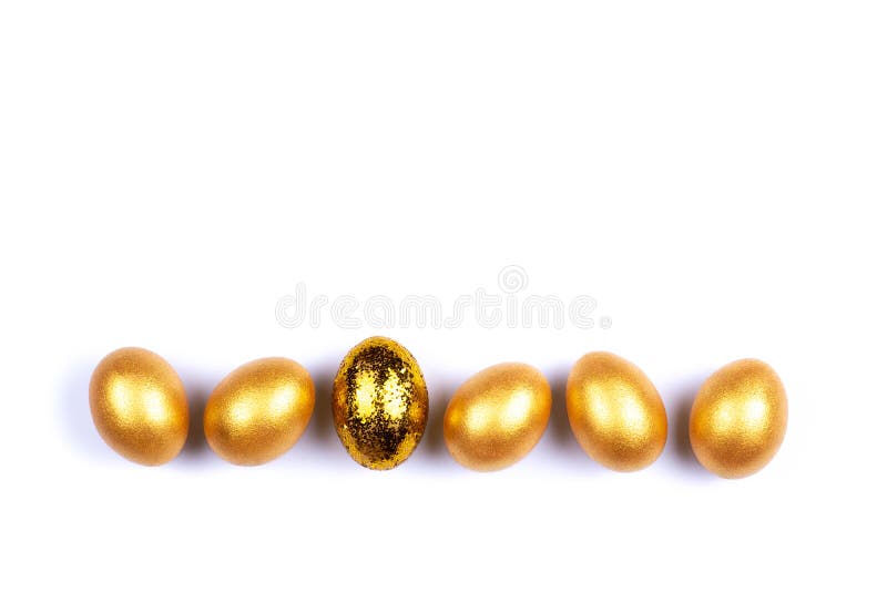 Six golden colored and decorated with sparkles Easter eggs isolated on white background. Happy Easter greeting card. Copy space. Easter background. Six golden colored and decorated with sparkles Easter eggs isolated on white background. Happy Easter greeting card. Copy space. Easter background.