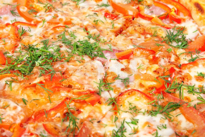 Golden crispy pizza with peppers and ham royalty free stock photo