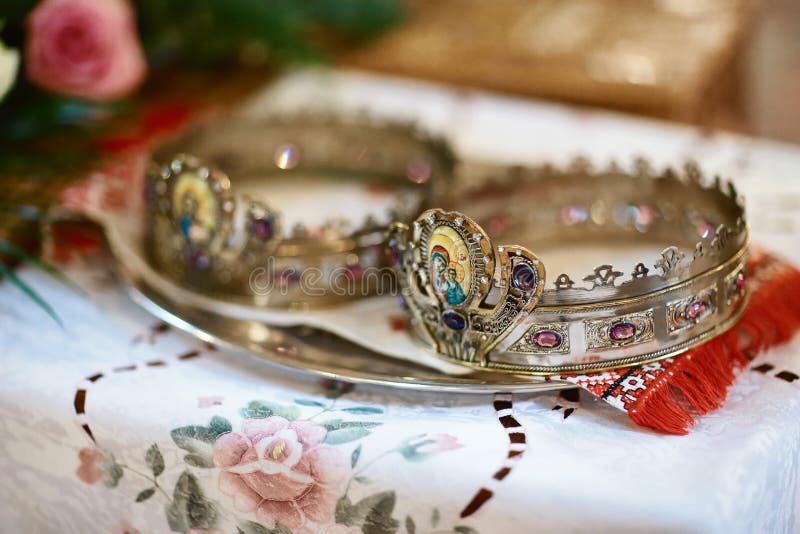 Golden crown at the altar in the church for the wedding couple traditional religious wedding ceremony royalty free stock photography Golden crown at the altar in the church for the wedding couple traditional religious wedding ceremony royalty free stock photography