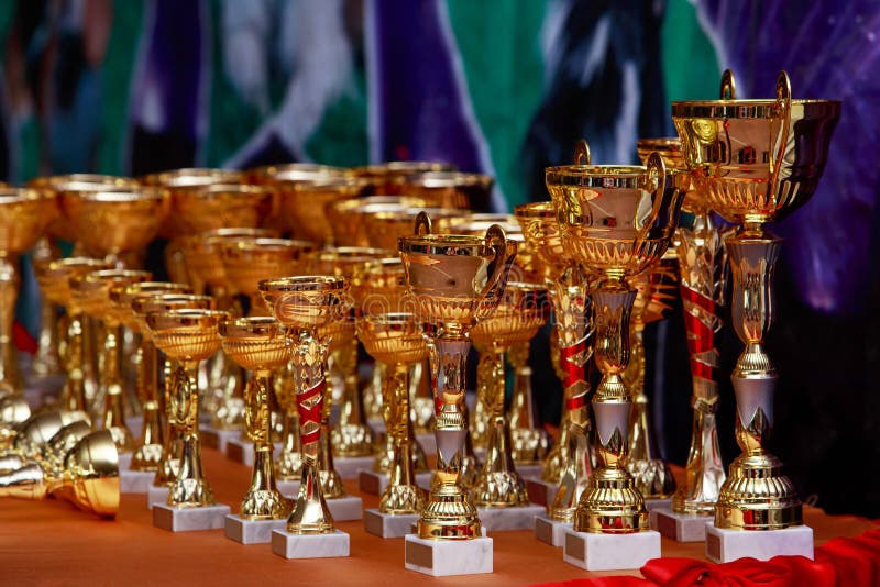 Golden cups for awarding stock image. Image of competition 97702167
