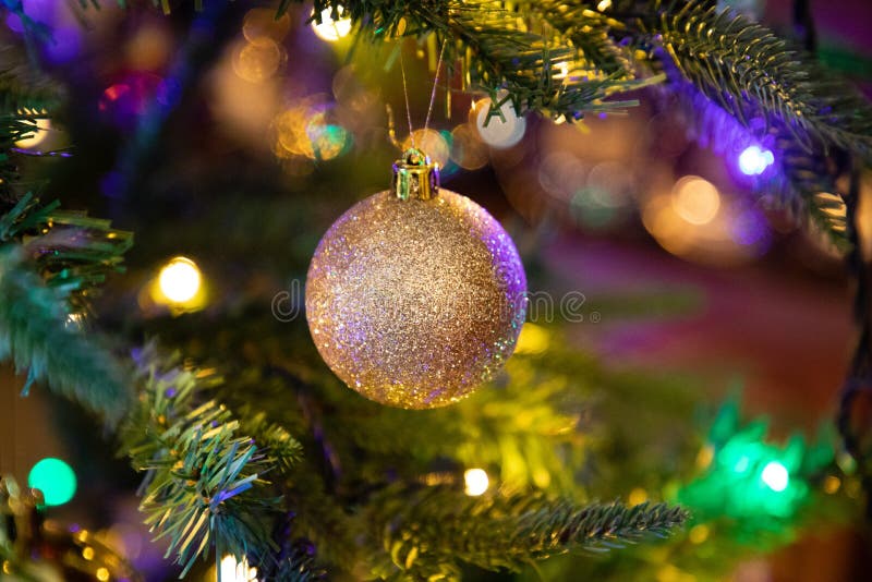 Golden Decoration Globe on Christmas Tree Close Up Stock Image - Image ...