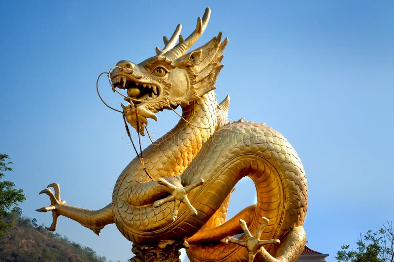 Golden dragon over blue sky royalty free stock photography