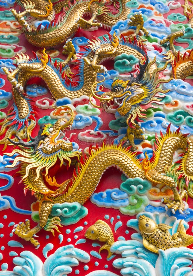 The golden dragon statue on wall at chinese temple royalty free stock photos