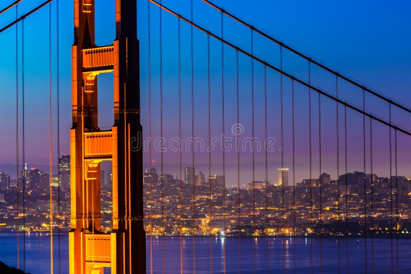 Golden Gate Bridge San Francisco sunset view through cables in California USA. Golden Gate Bridge San Francisco sunset view through cables in California USA
