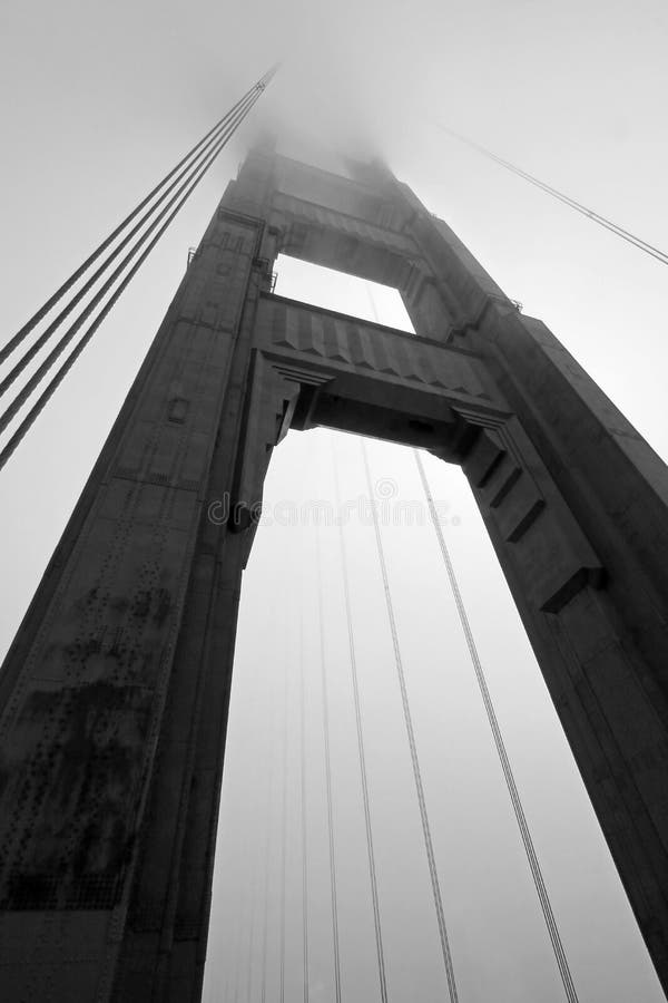 Golden Gate Bridge tower in black and white with fog rolling, San Francisco