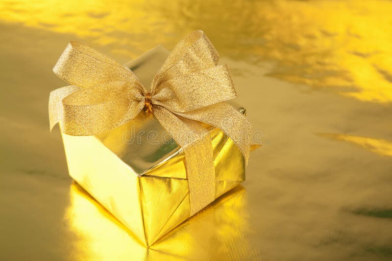 Golden gift box with bow stock image. Image of gift, package 14157101