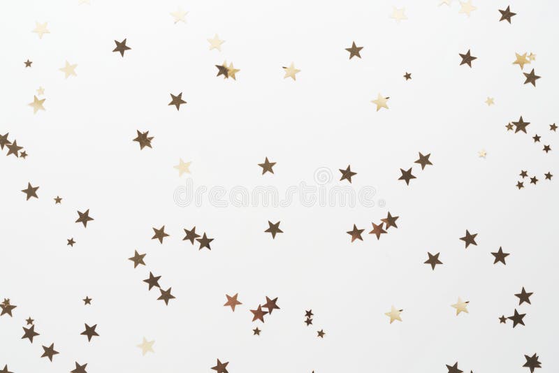 Golden glitter, confetti stars isolated on white background. Christmas, party or birthdau background