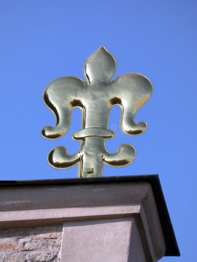 Golden Heraldic Lily on the Roof of the Dome Cathedral Stock Photo