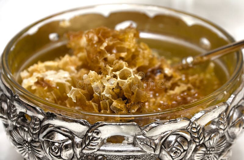 Golden Honeycomb in Bowl stock image