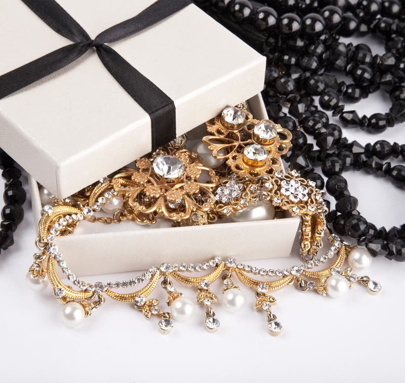 Golden jewelry and gifts stock image. Image of expensive 25828705