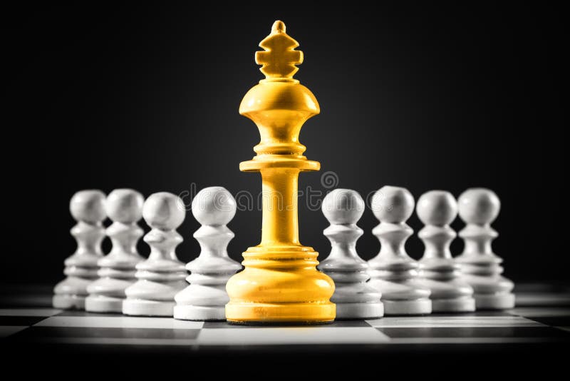 Golden king chess standing in front of the pawn chess stock photography
