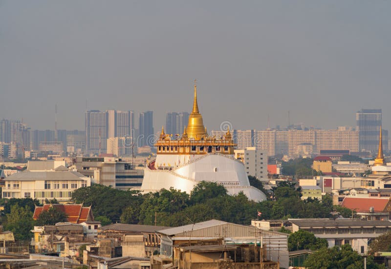 Golden Mountain pagoda, a buddhist temple or Wat Saket in Bangkok Downtown, urban city with sunset sky, Thailand. Thai